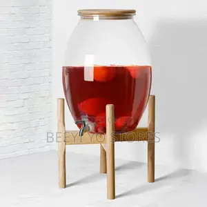 Large Glass Beverage Dispenser With Wooden Lid and Stand.
