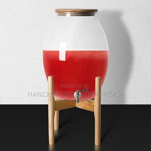 Large Glass Beverage Dispenser With Wooden Lid and Stand.