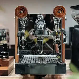 Countertop Espresso Machine With Dual Steam Wands and Wood Accents.