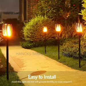 Solar-Powered Flickering Flame Garden Torch Lights.