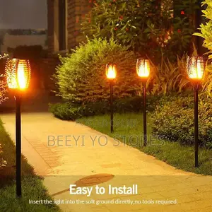 Solar-Powered Flickering Flame Garden Torch Lights.