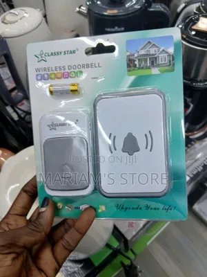 Wireless Doorbell Kit Featuring a White and Grey Transmitter Button.