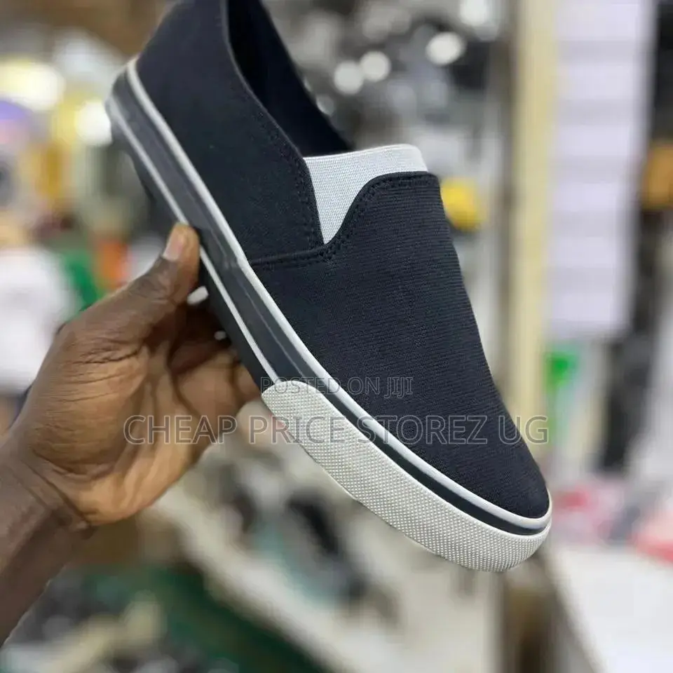 These Men's Slip-on Shoes Feature a Black Canvas Upper With White