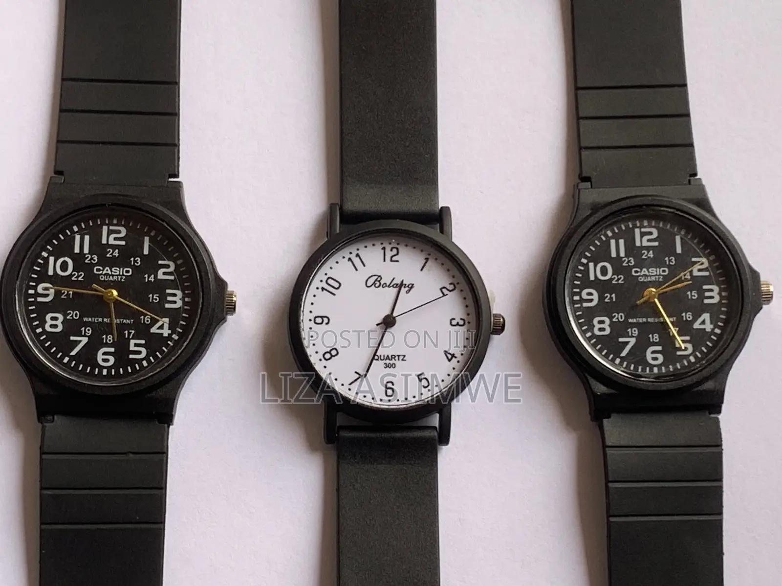 Black Casio MQ-24 Series Watches and a White Bolang Analog Watch