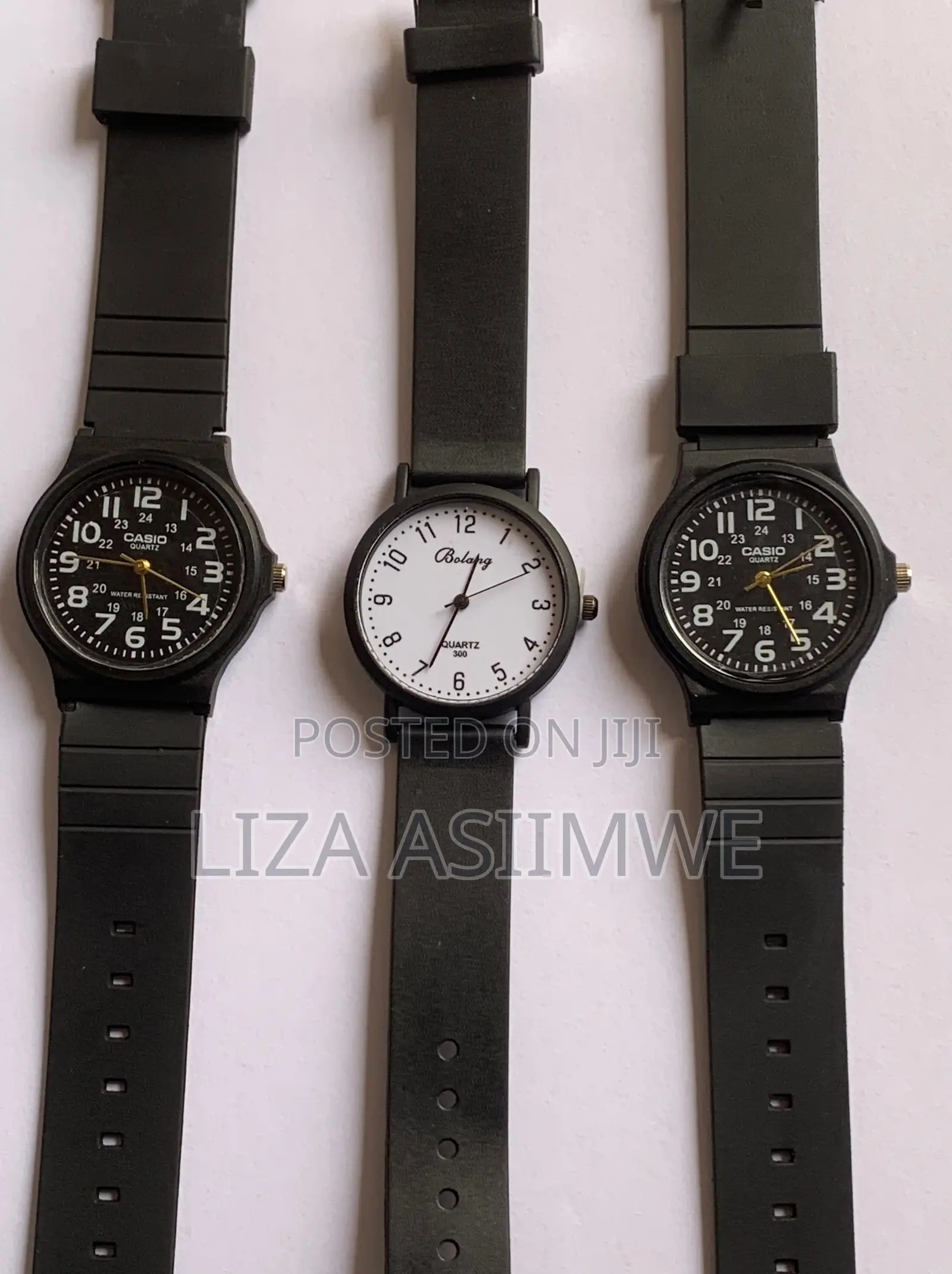 Black Casio MQ-24 Series Watches and a White Bolang Analog Watch