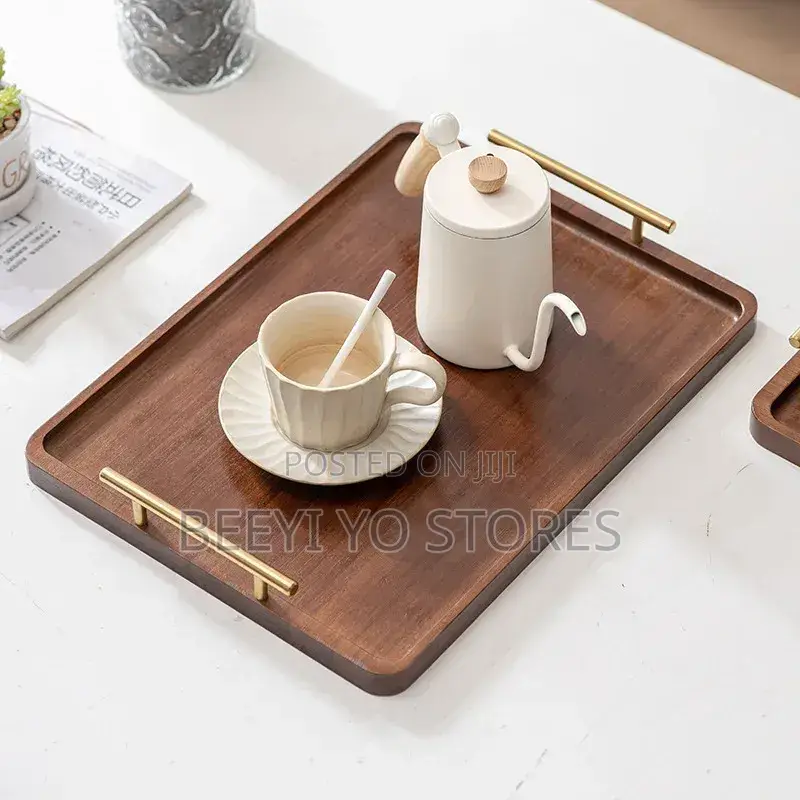 Set of Nested Wooden Serving Trays With Gold Handles.