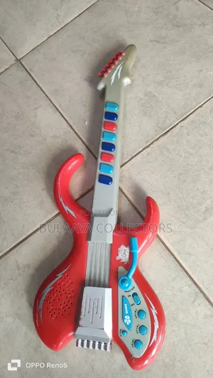 UK Used Red and Gray Plastic Toy Electric Guitar Designed for Children