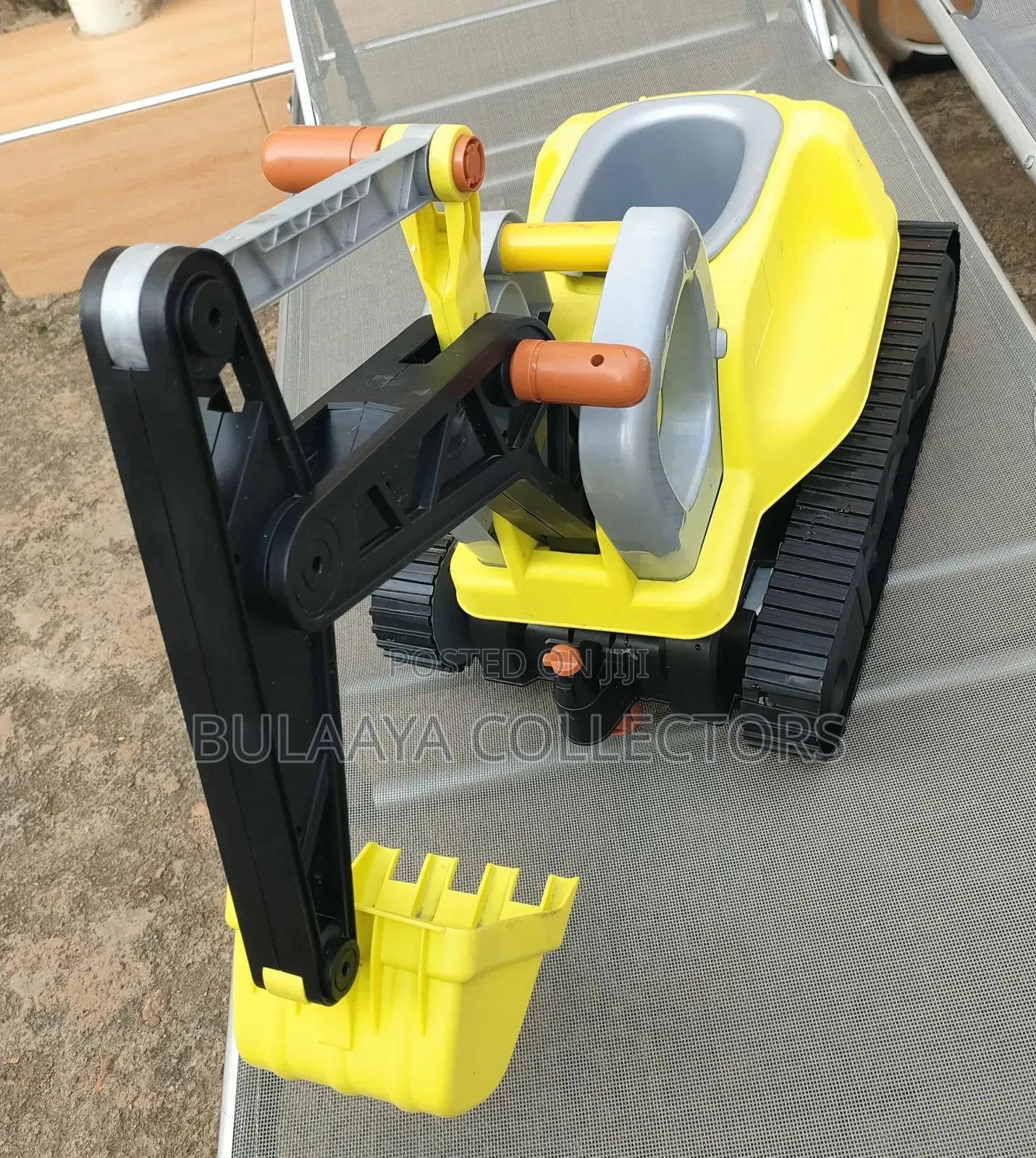 UK Used Yellow and Black Children's Ride-on Excavator Toy.