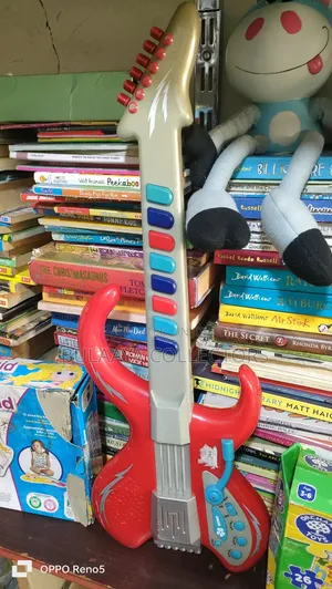 UK Used Red and Gray Plastic Toy Electric Guitar Designed for Children