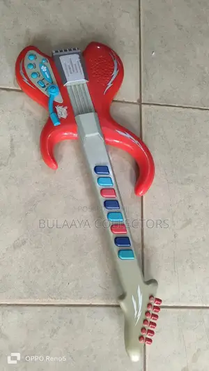 UK Used Red and Gray Plastic Toy Electric Guitar Designed for Children