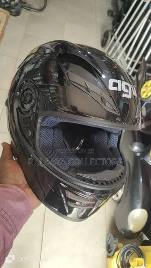 UK Used AGV Motorcycle Helmet in Glossy Black.