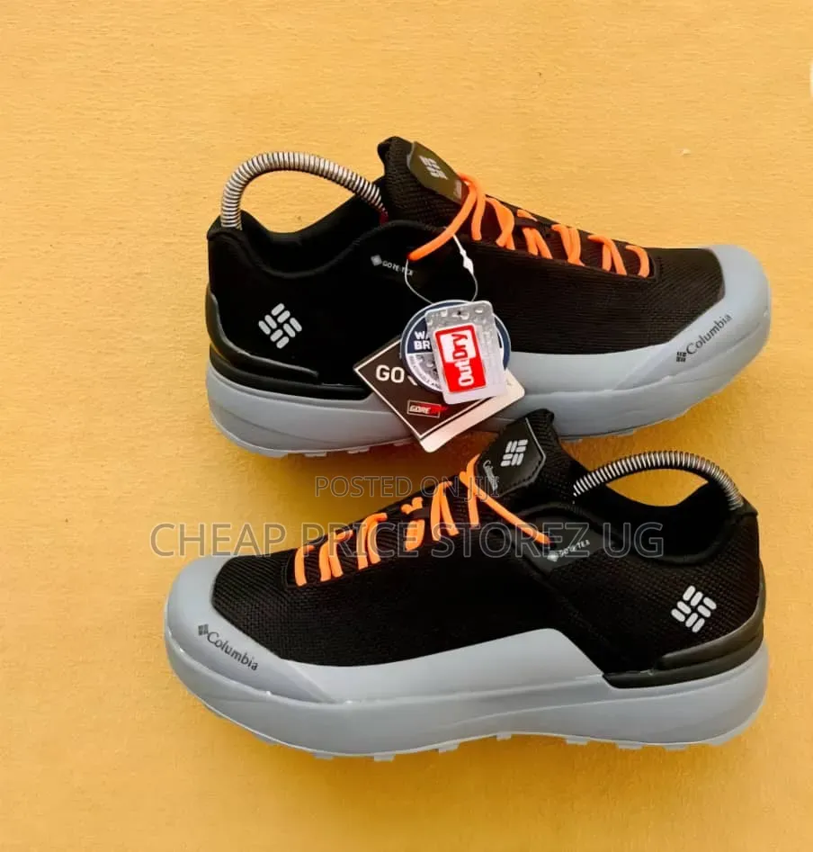 A Pair of Black and Grey Columbia Trail Hiking Shoe Bright Orange Lace