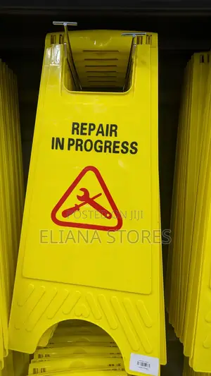Repair in Progress Sign Post