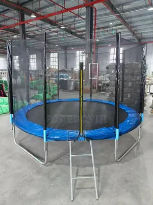 A Round Backyard 10 Ft Trampoline With a Safety Enclosure Net