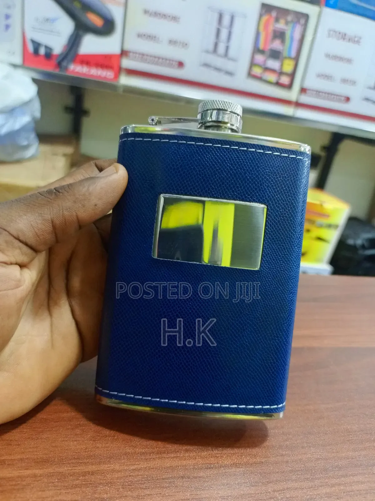 Stainless Steel Hip Flask Wrapped in Textured Blue Faux Leather.