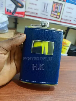 Stainless Steel Hip Flask Wrapped in Textured Blue Faux Leather.