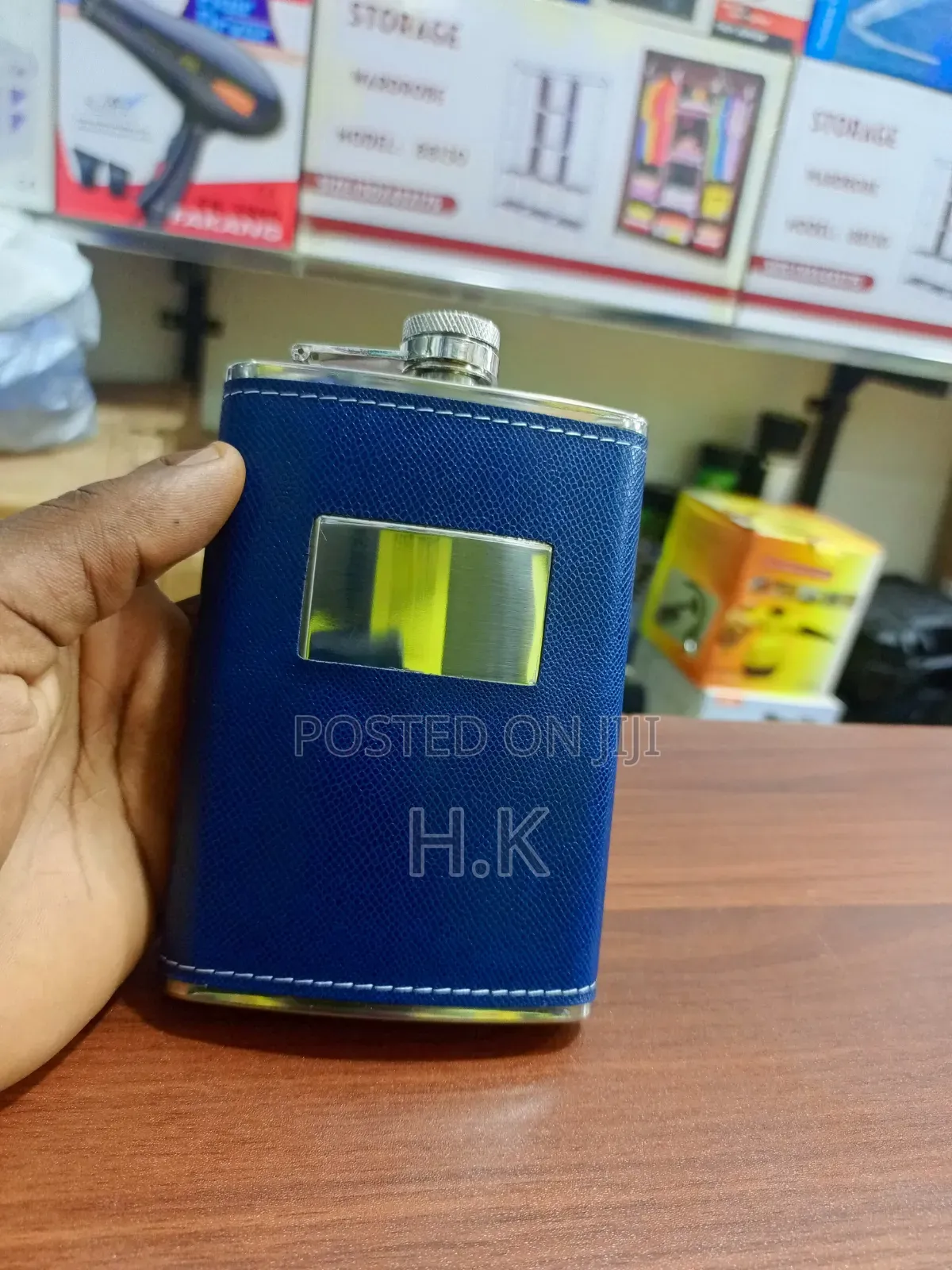 Stainless Steel Hip Flask Wrapped in Textured Blue Faux Leather.