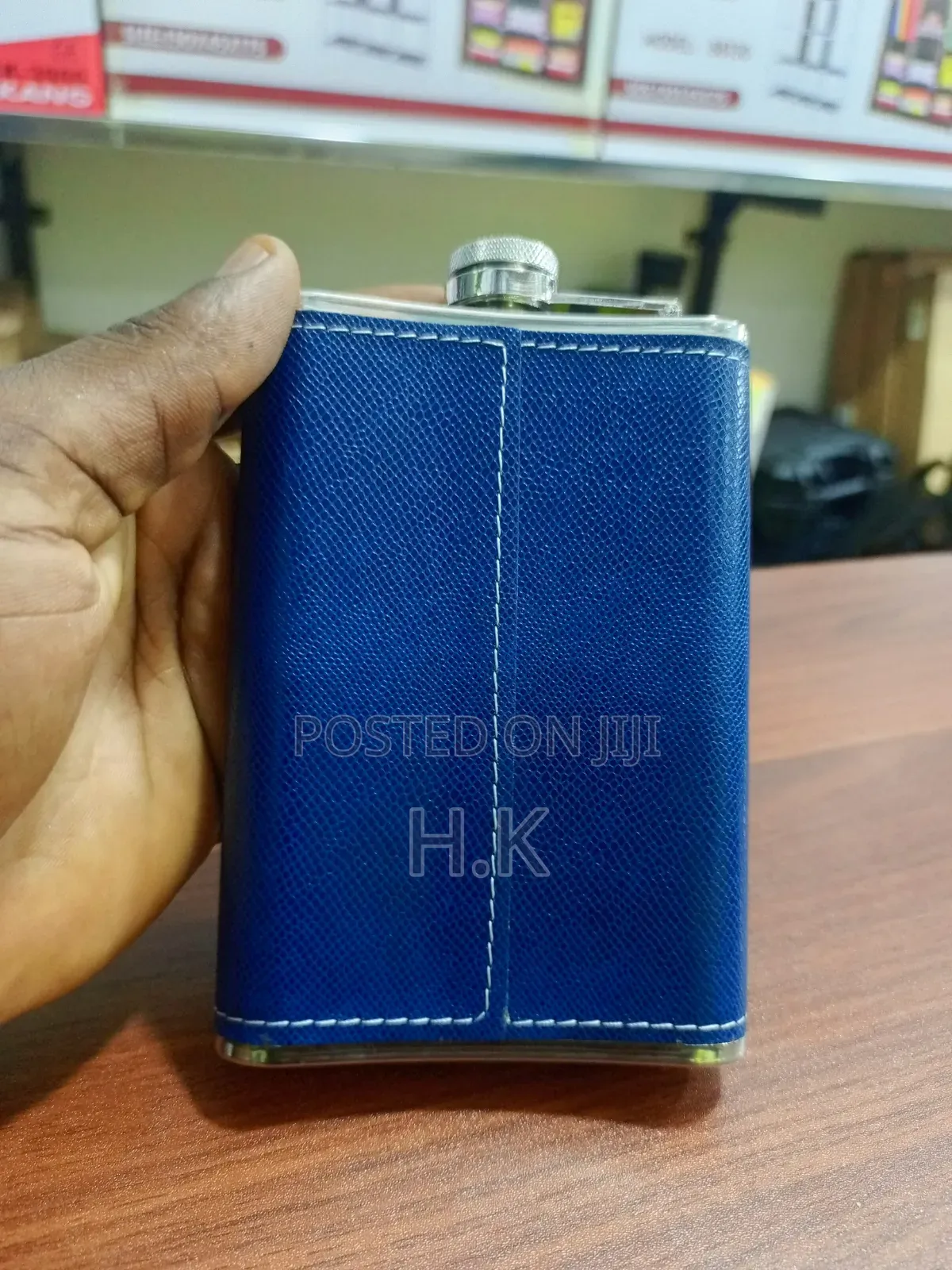Stainless Steel Hip Flask Wrapped in Textured Blue Faux Leather.