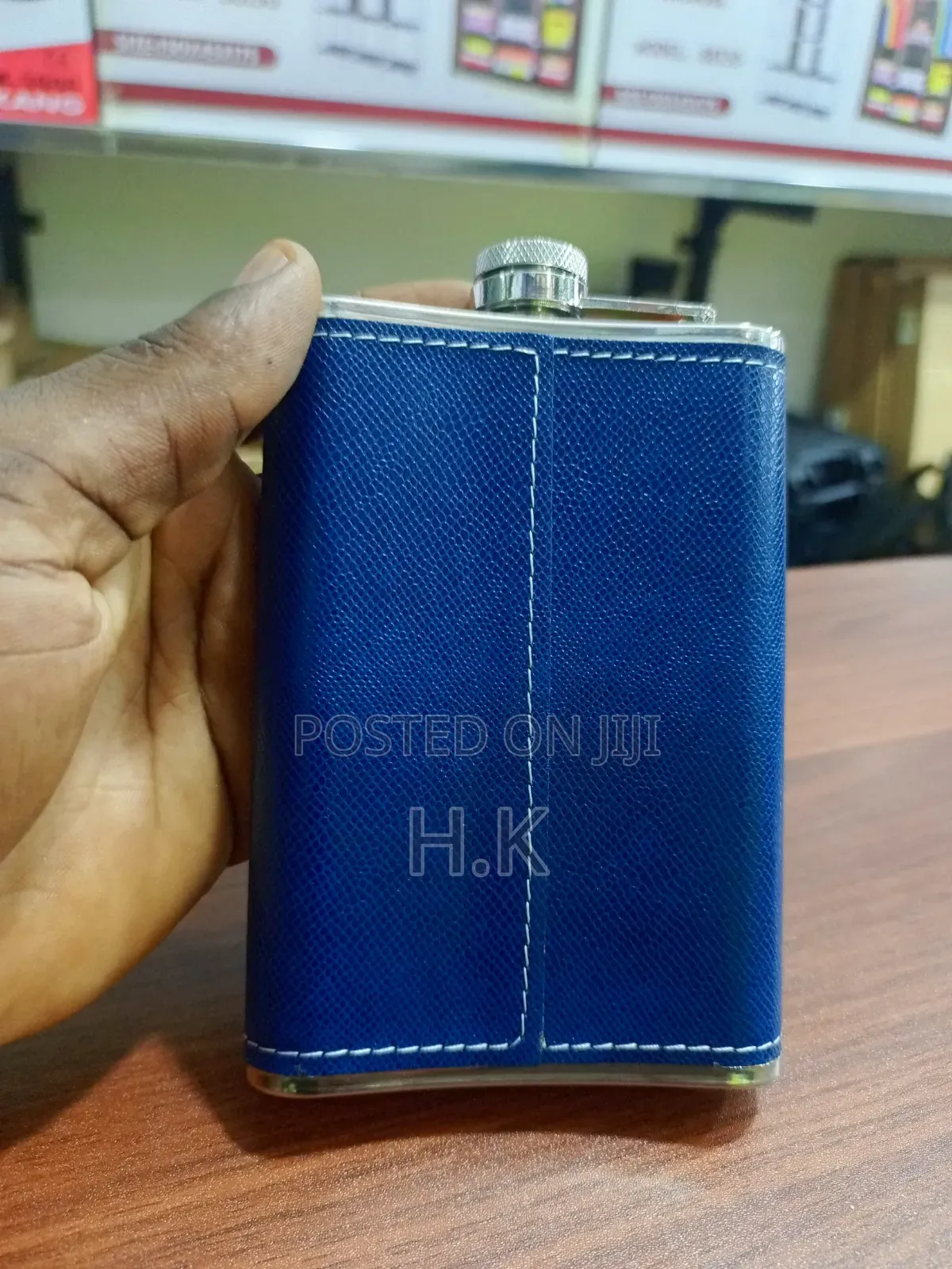 Stainless Steel Hip Flask Wrapped in Textured Blue Faux Leather.
