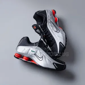 Nike Shox R4 in the "Black/Metallic Silver-Bright Crimson" Colorway,