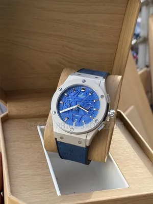 Displays a Hublot-Style Blue Chronograph Watch Featuring a Blue Dial,