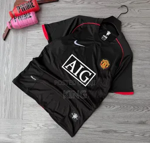 Iconic Black and Red Nike Man U Jersey Kit