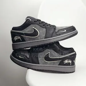 Stüssy-Branded Nike Air Jordan 1 Low Sneaker Featuring Black-and-Grey