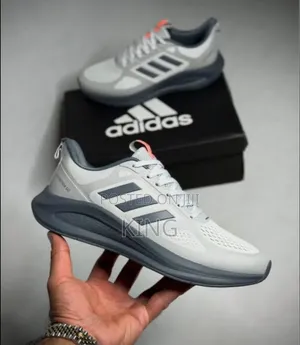Adidas Lightmotion Go Voeuy Running Shoes in a Light Grey