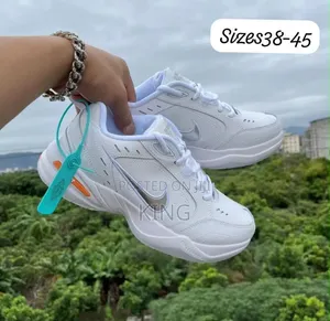 Nike Air Monarch IV "Snow Day" Walking Shoes. Clean White