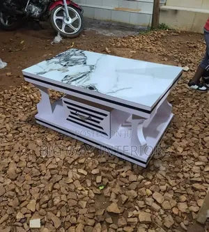 White and Black Center Table With Silver Handle