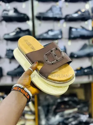 Slide Sandals Feature a Thick Ridged White Sole