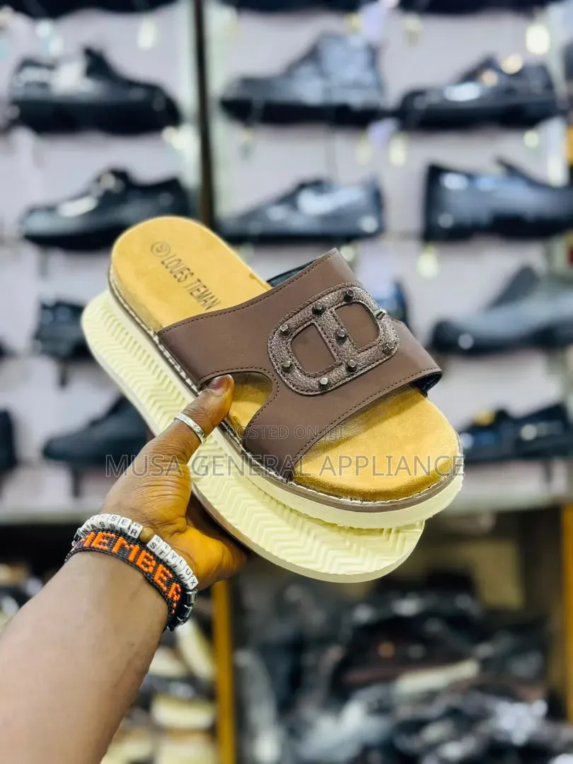 Slide Sandals Feature a Thick Ridged White Sole