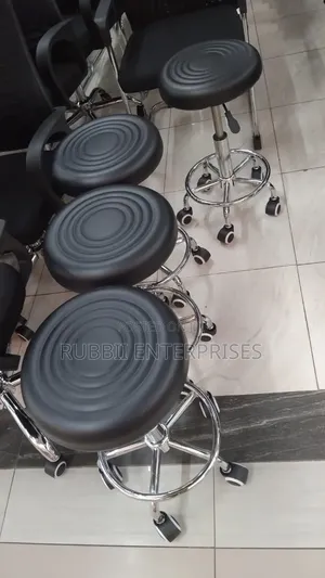 Movable Black Adjustable Rolling Swivel Stool.