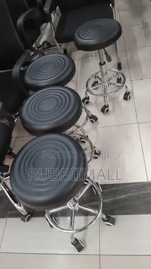 Movable Black Adjustable Rolling Swivel Stool.
