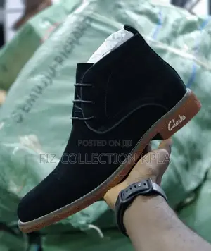 9. Black Clarks Suede Ankle Boots With Brown Rubber Sole