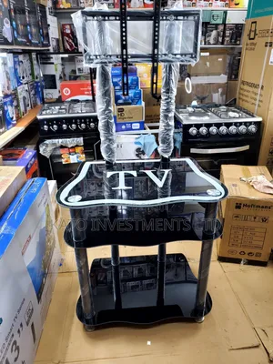 Glass TV Stand With a Built-in TV Mount Bracket