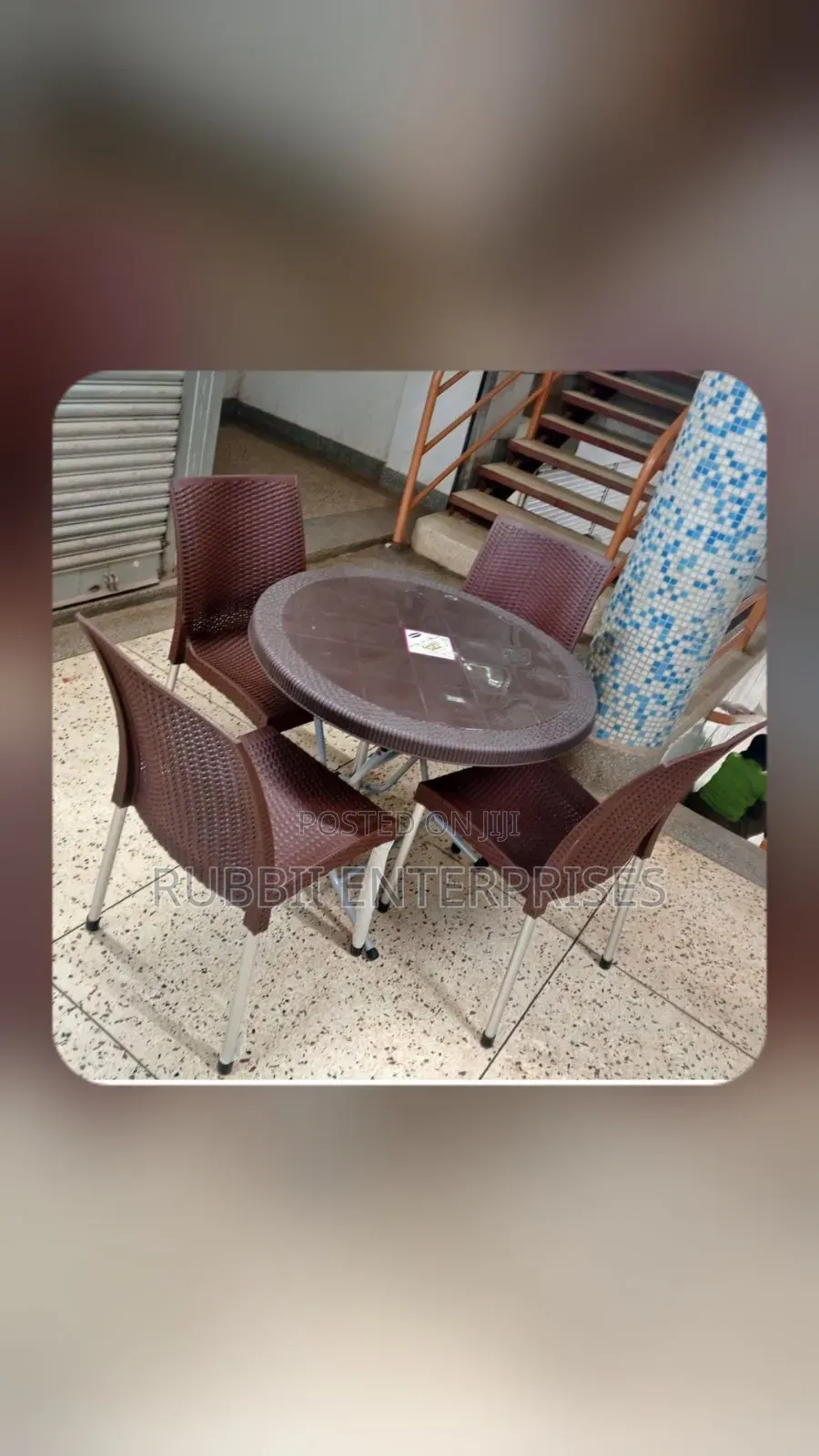 1 Round Table + 4 Brown Rattan-Textured Armless Plastic Chair