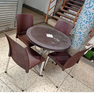 1 Round Table + 4 Brown Rattan-Textured Armless Plastic Chair