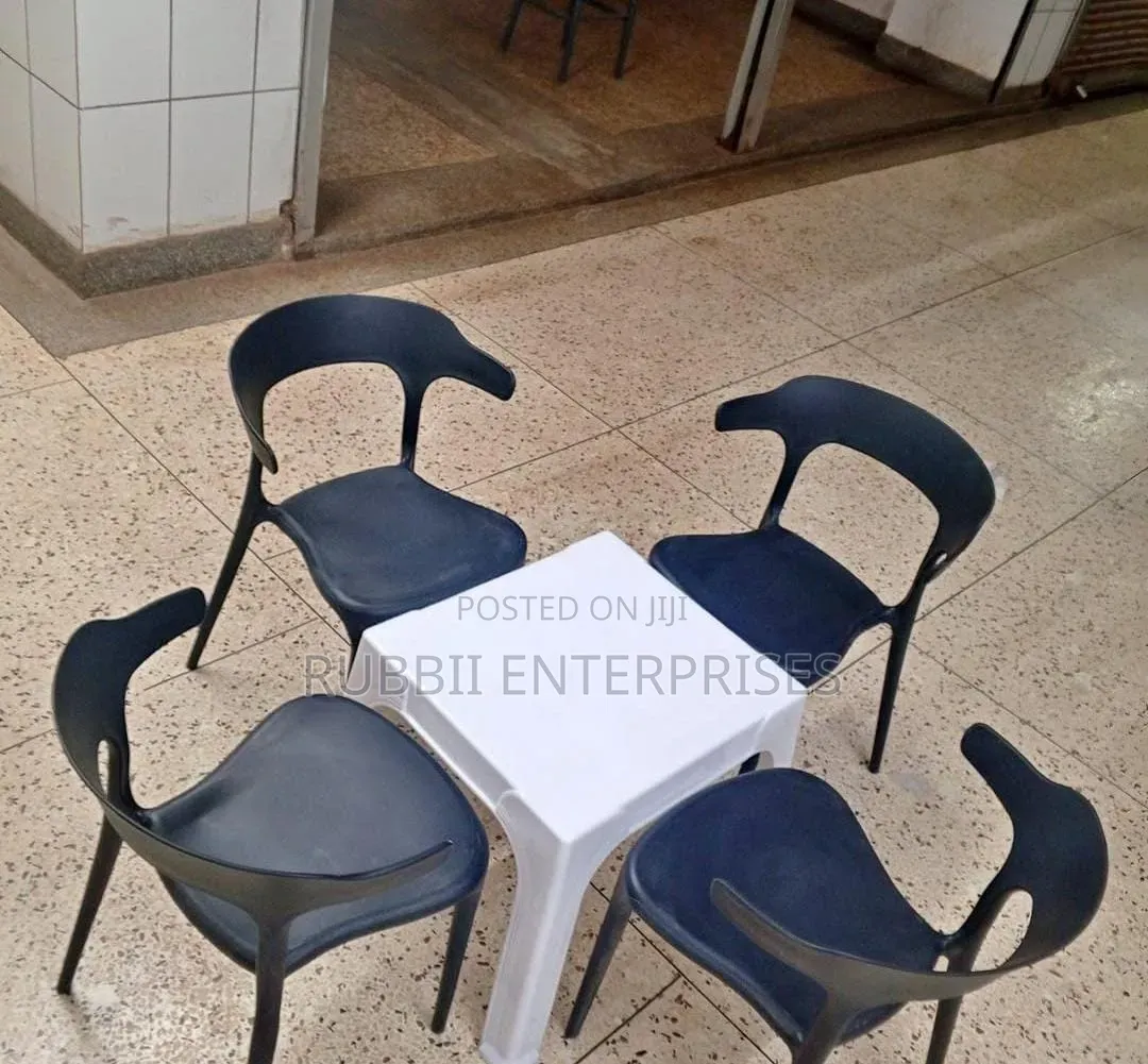 1 Small White Table + 4 Curved - Back Arm Chairs