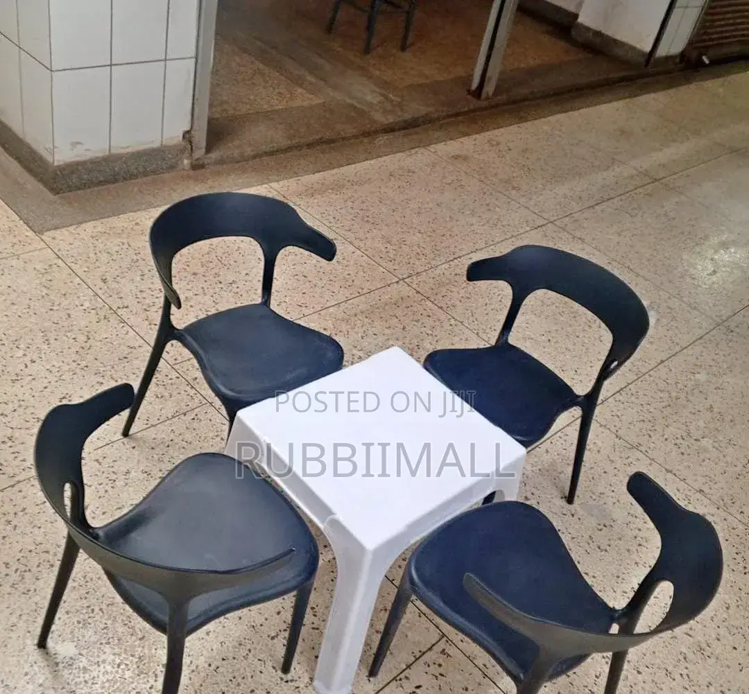 1 Small White Table + 4 Curved - Back Arm Chairs
