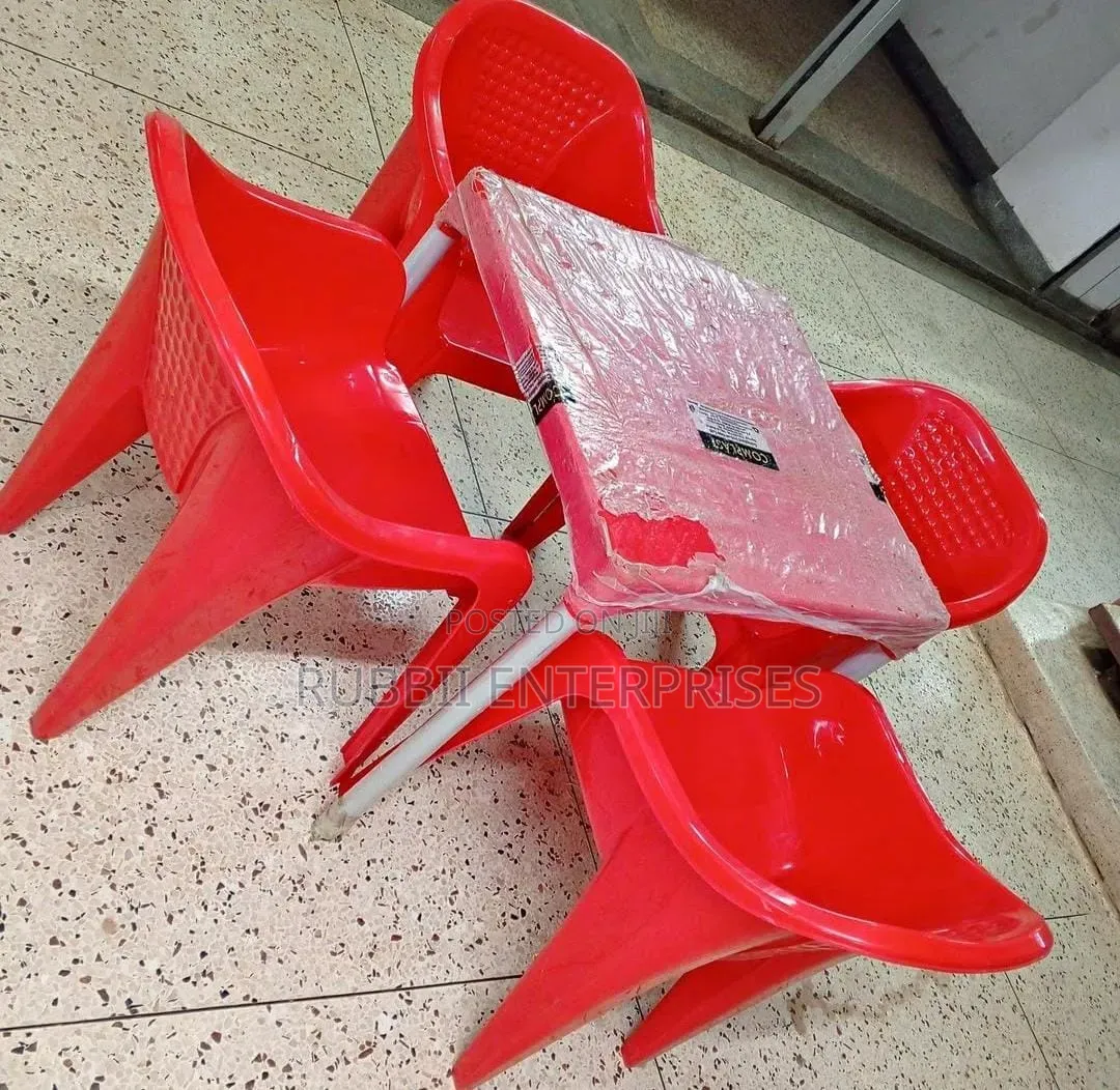 1 Red Table + 4 Molded Plastic Arm Chair
