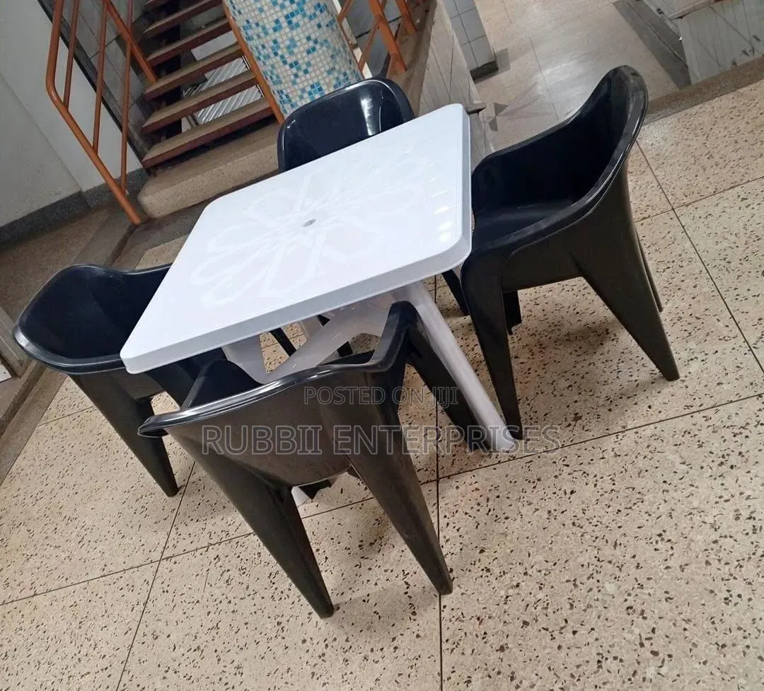 1 White Table + 4 Molded Plastic Arm Chair