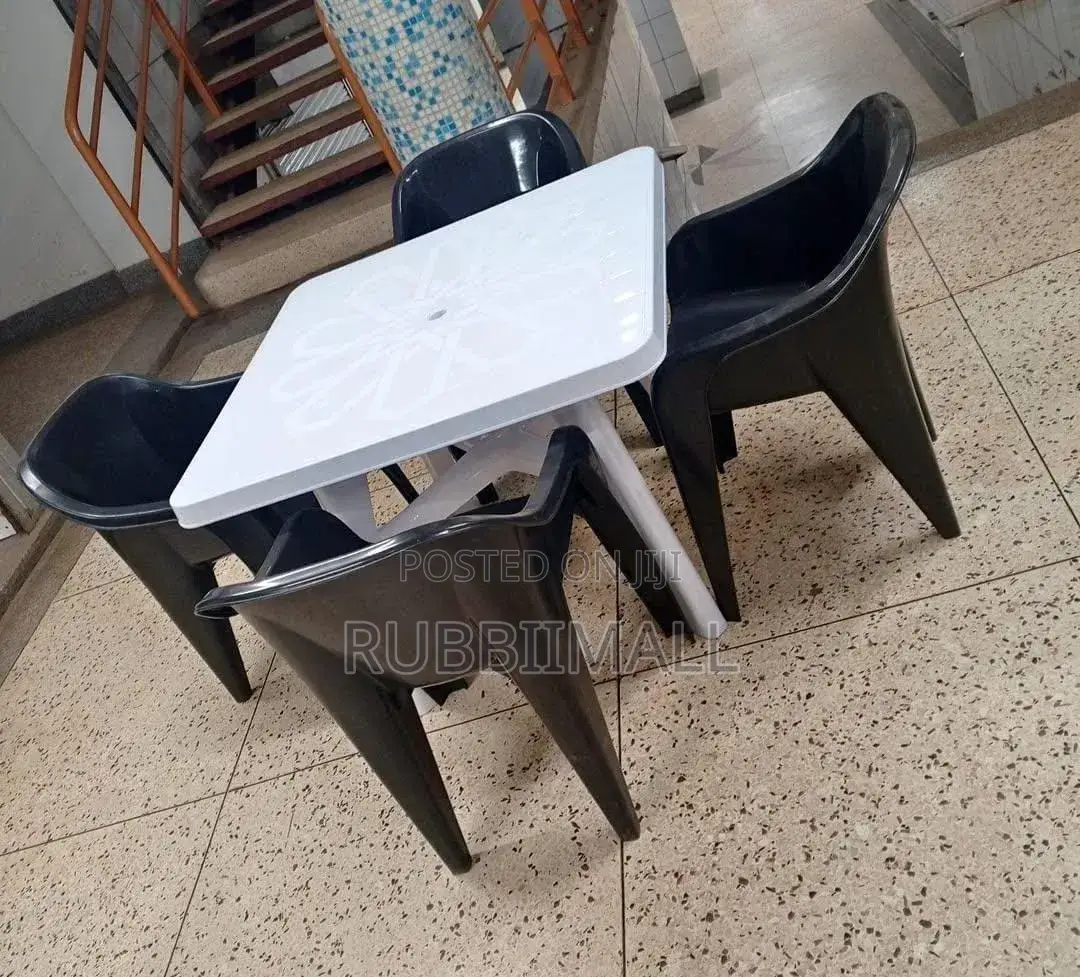 1 White Table + 4 Molded Plastic Arm Chair