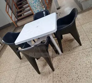 1 White Table + 4 Molded Plastic Arm Chair