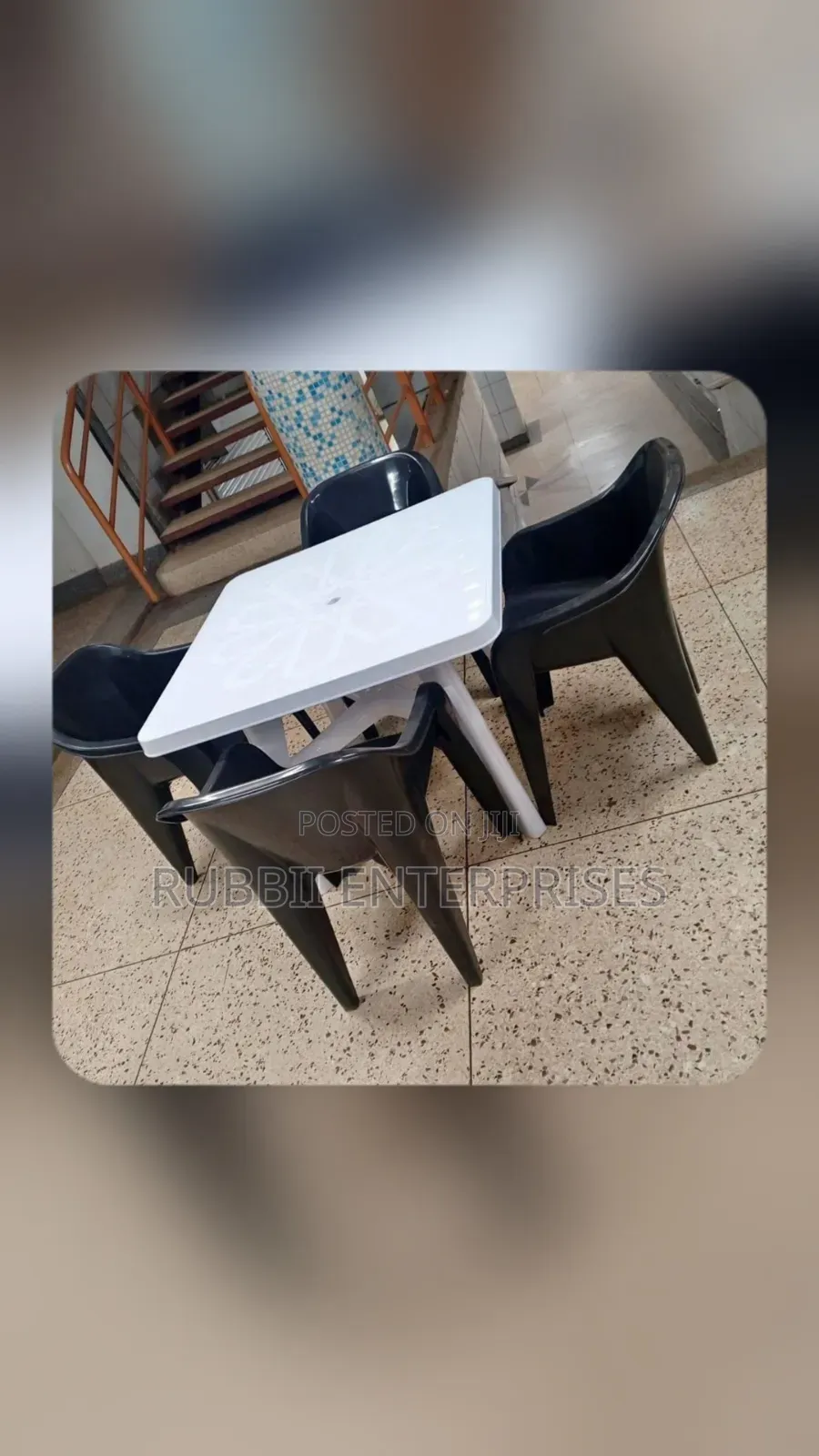 1 White Table + 4 Molded Plastic Arm Chair