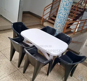1 White Oval Table + 6 Molded Plastic Arm Chair