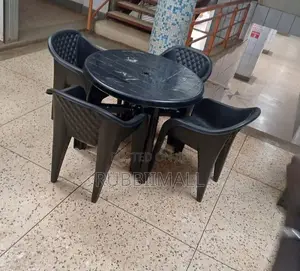 1 Round Table + 4 Molded Plastic Arm Chair