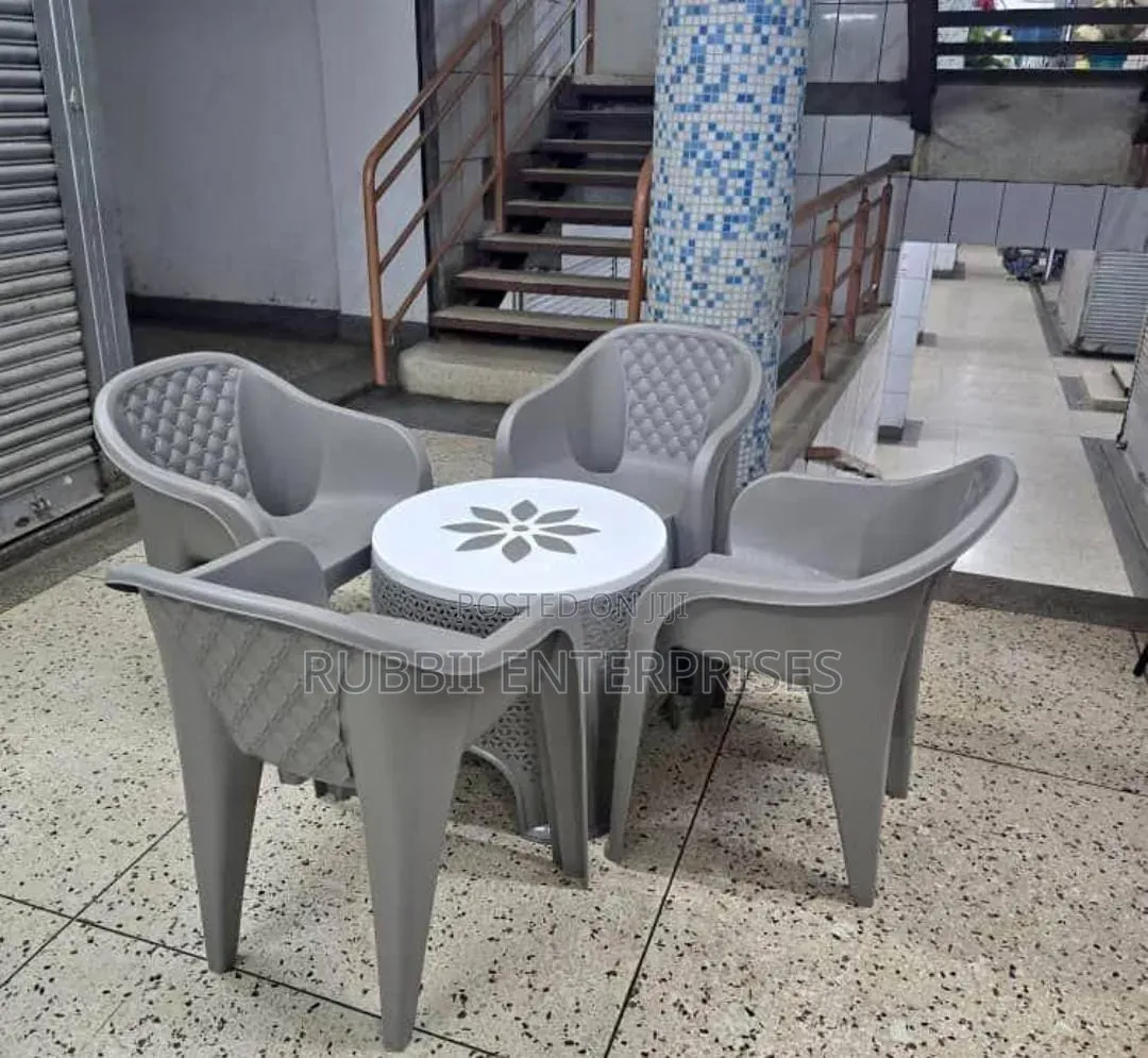 1 Round Plastic Patio Table + 4 Molded Plastic Arm Chair