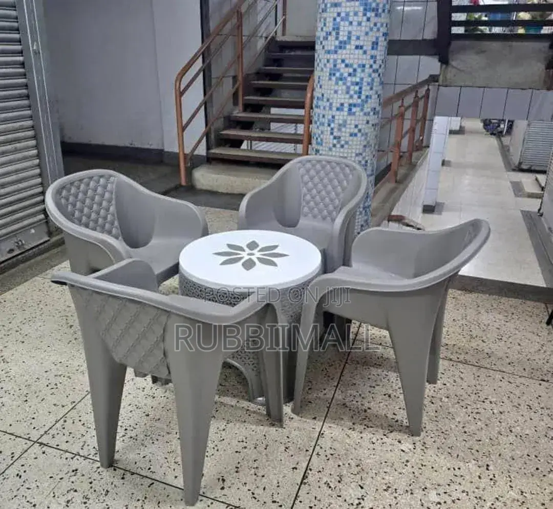 1 Round Plastic Patio Table + 4 Molded Plastic Arm Chair