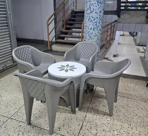 1 Round Plastic Patio Table + 4 Molded Plastic Arm Chair
